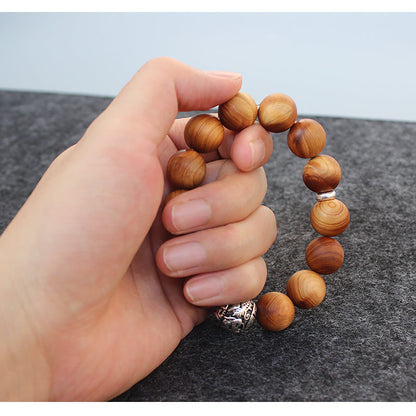 Buddhist Handcrafted Nature Sandalwood Bracelet for "Power & Adventure" (with Traditional Dragon Amulet)