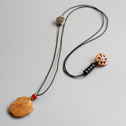 Protective Lotus Pendant (Tagua Nut)