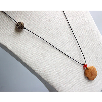 Protective Lotus Pendant (Tagua Nut)