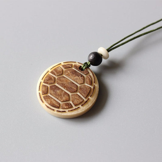 Artisan Carved Harmony Pendant (Tagua Nut)
